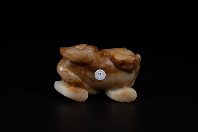 A large Chinese white and russet jade sculpture of a mythical beast, 17/18th C.