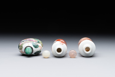 Three Chinese famille rose and iron-red 'Buddhist lion' and 'dragon' snuff bottles, 19th C.