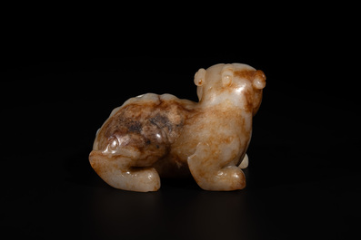 A large Chinese white and russet jade sculpture of a mythical beast, 17/18th C.