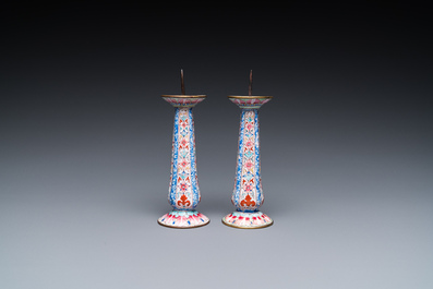 A pair of Chinese Canton enamel candlesticks with floral design, Yongzheng/Qianlong