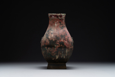 A Chinese archaic bronze vase with 'Taotie' handles, 'fang hu 方壺', Han