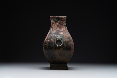 A Chinese archaic bronze vase with 'Taotie' handles, 'fang hu 方壺', Han