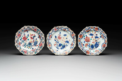 Two sets of six Chinese famille rose plates with peonies, Yongzheng/Qianlong