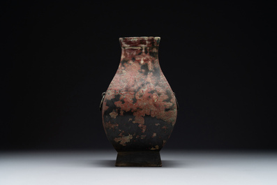 A Chinese archaic bronze vase with 'Taotie' handles, 'fang hu 方壺', Han