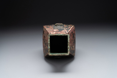 A Chinese archaic bronze vase with 'Taotie' handles, 'fang hu 方壺', Han