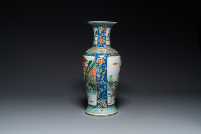 A Chinese famille verte vase with warriors on horseback, 19th C.