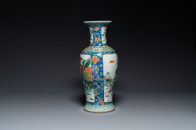 A Chinese famille verte vase with warriors on horseback, 19th C.