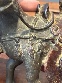 A rare Chinese partly lacquered and gilt bronze incense holder in the shape of a horse, Yuan/early Ming
