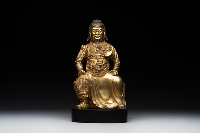 An extremely rare Chinese gilt bronze figure of Guandi, Ming