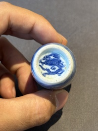 A Chinese blue, white and copper-red 'camel' snuff bottle, dragon mark, 19th C.