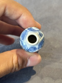 A Chinese blue and white 'figurative' snuff bottle and a blue, white and iron-red 'dragon' snuff bottle, Qianlong mark, 19th C.