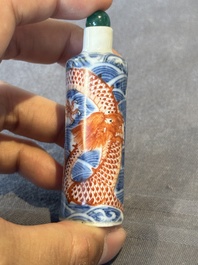 A Chinese blue and white 'figurative' snuff bottle and a blue, white and iron-red 'dragon' snuff bottle, Qianlong mark, 19th C.