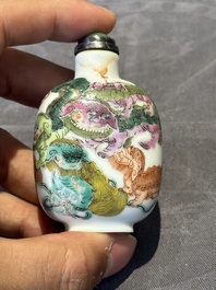 Three Chinese famille rose and iron-red 'Buddhist lion' and 'dragon' snuff bottles, 19th C.