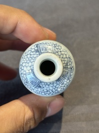 A Chinese blue, white and copper-red snuff bottle with a dragon, dragon mark, 19th C.