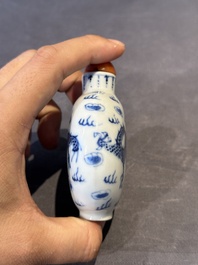 Three Chinese blue, white and copper-red snuff bottles and a blue and white snuff bottle, Qianlong mark, 19th C.