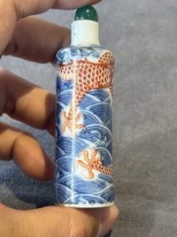 A Chinese blue and white 'figurative' snuff bottle and a blue, white and iron-red 'dragon' snuff bottle, Qianlong mark, 19th C.