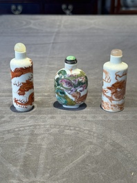 Three Chinese famille rose and iron-red 'Buddhist lion' and 'dragon' snuff bottles, 19th C.