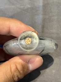 Five Chinese rock crystal and needle agate snuff bottles, Qing