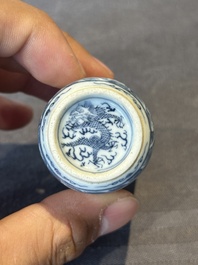 A Chinese blue, white and copper-red snuff bottle with a dragon, dragon mark, 19th C.