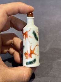 A Chinese copper-red 'dragon' snuff bottle and two famille verte snuff bottles, Gu Yue Xuan 古月軒 and Daoguang mark, 19th C.