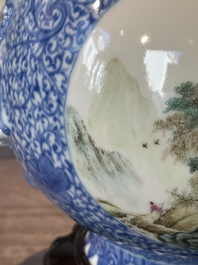 A pair of Chinese famille rose 'hu' vases with fine landscapes, Qianlong mark, Republic