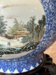 A pair of Chinese famille rose 'hu' vases with fine landscapes, Qianlong mark, Republic