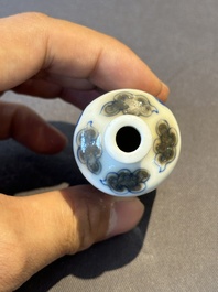 A Chinese blue, white and copper-red 'camel' snuff bottle, dragon mark, 19th C.