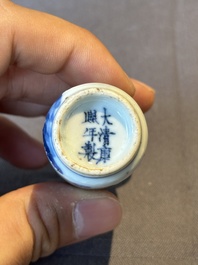 A Chinese blue, white and copper-red 'warriors' snuff bottle, Kangxi mark, 19th C.