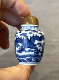 Three Chinese blue and white 'dragon' snuff bottles, 19th C.