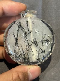 Five Chinese rock crystal and needle agate snuff bottles, Qing