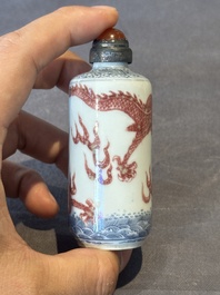 A Chinese blue, white and copper-red snuff bottle with a dragon, dragon mark, 19th C.