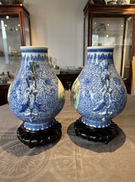 A pair of Chinese famille rose 'hu' vases with fine landscapes, Qianlong mark, Republic