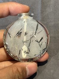 Five Chinese rock crystal and needle agate snuff bottles, Qing