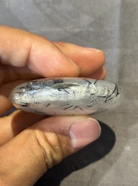 Five Chinese rock crystal and needle agate snuff bottles, Qing