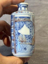 Four Chinese blue, white and copper-red snuff bottles and a blue and white snuff bottle, 19/20th C.
