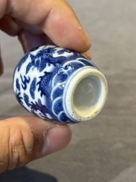 Three Chinese blue and white 'dragon' snuff bottles, 19th C.