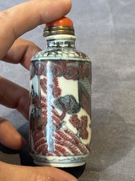 Five Chinese blue, white and copper-red snuff bottles, 19/20th C.