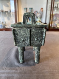 A Chinese rectangular bronze food vessel, 'fang ding 方鼎', Western Zhou
