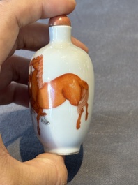 A fine Chinese iron-red and grisaille 'horse and man' snuff bottle, 19th C.