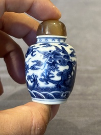 Three Chinese blue and white 'dragon' snuff bottles, 19th C.