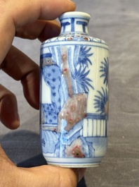 Four Chinese blue, white and copper-red snuff bottles and a blue and white snuff bottle, 19/20th C.