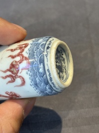 A Chinese blue, white and copper-red snuff bottle with a dragon, dragon mark, 19th C.
