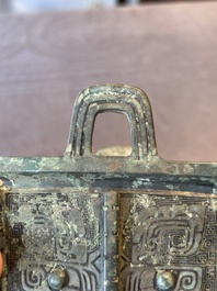 A Chinese rectangular bronze food vessel, 'fang ding 方鼎', Western Zhou