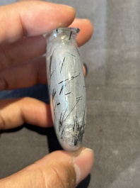 Five Chinese rock crystal and needle agate snuff bottles, Qing