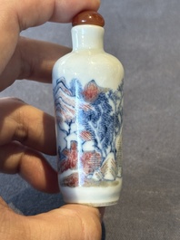 A Chinese blue, white and copper-red 'landscape' snuff bottle, 19th C.