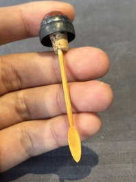 A Chinese blue, white and copper-red snuff bottle with a dragon, dragon mark, 19th C.