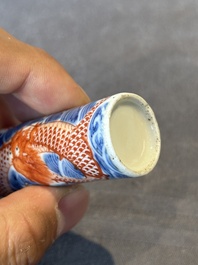 A Chinese blue and white 'figurative' snuff bottle and a blue, white and iron-red 'dragon' snuff bottle, Qianlong mark, 19th C.
