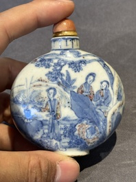 Three Chinese blue, white and copper-red snuff bottles and a blue and white snuff bottle, Qianlong mark, 19th C.