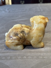 A large Chinese white and russet jade sculpture of a mythical beast, 17/18th C.