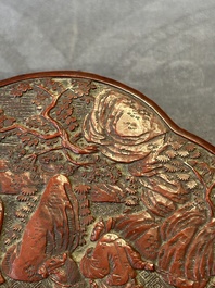 A Chinese quadrifoil red cinnabar lacquer box and cover with figural design, 19/20th C.